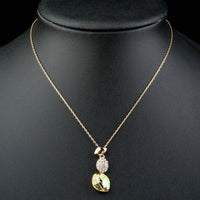 Close up detail of KHAISTA gold crystal sensation pendant necklace