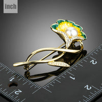 Close up of pearl flowers on KHAISTA gold branch brooch