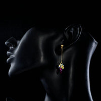 Side angle view of KHAISTA gradient heart crystal drop earrings