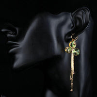 Close up of KHAISTA gradual change crystal drop earrings