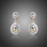 KHAISTA gradual change crystal drop earrings on white background