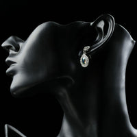 Close up of KHAISTA gradual change crystal drop earrings