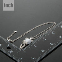 Pendant detail on KHAISTA grey crystal cat pendant necklace
