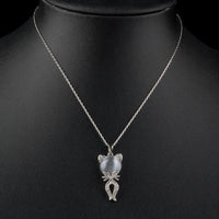 Close up detail of KHAISTA grey crystal cat pendant necklace