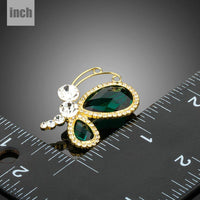 Close-up of green Austrian crystals on Khaista butterfly brooch