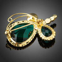 Butterfly wing detail on Khaista green crystal brooch