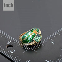 Crown detail on Khaista green gold plated oil paint ring