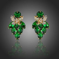 KHAISTA green CZ butterfly drop earrings on white background