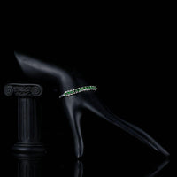 Side angle view of KHAISTA green CZ link chain bracelet