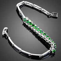 Close up detail of KHAISTA green CZ link chain bracelet