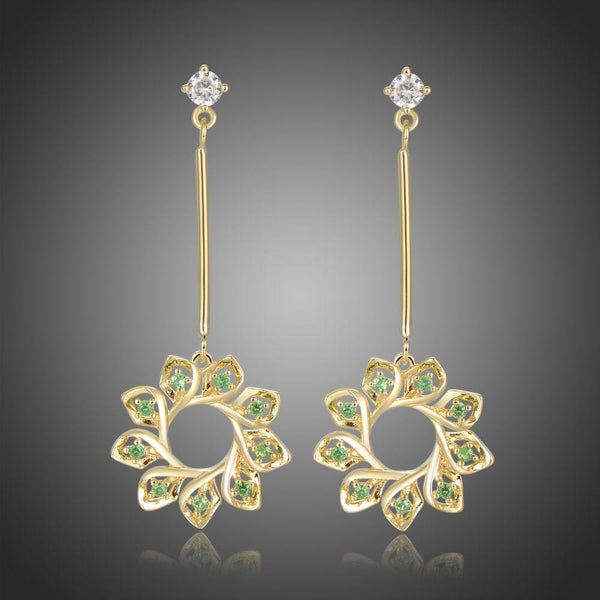 KHAISTA green CZ statement earrings on white background