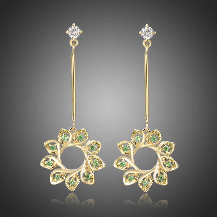 KHAISTA green CZ statement earrings on white background