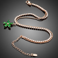 Close up detail of KHAISTA green flower charm bracelet
