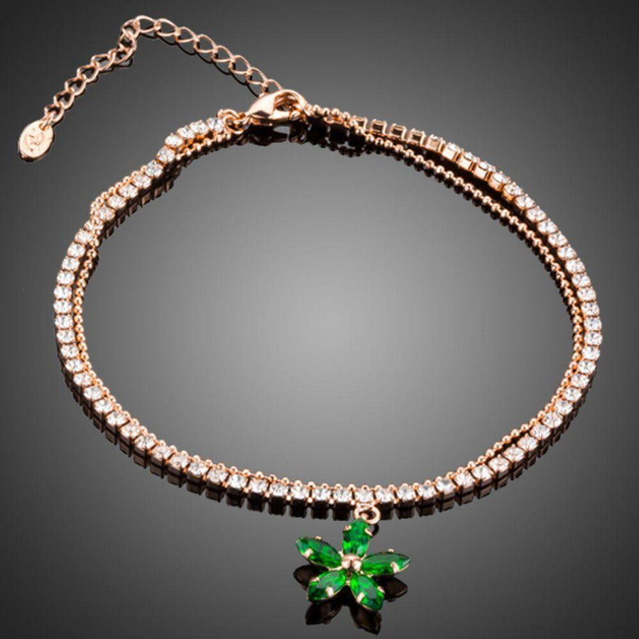 KHAISTA green flower charm bracelet on white background