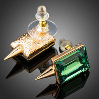 Close up of KHAISTA green rectangle crystal stud earrings