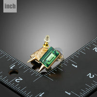 green rectangle crystal stud earrings detail view by KHAISTA