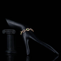 Side angle view of KHAISTA green stone designer bracelet