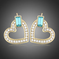KHAISTA blue Austrian crystal heart stud earrings on white background