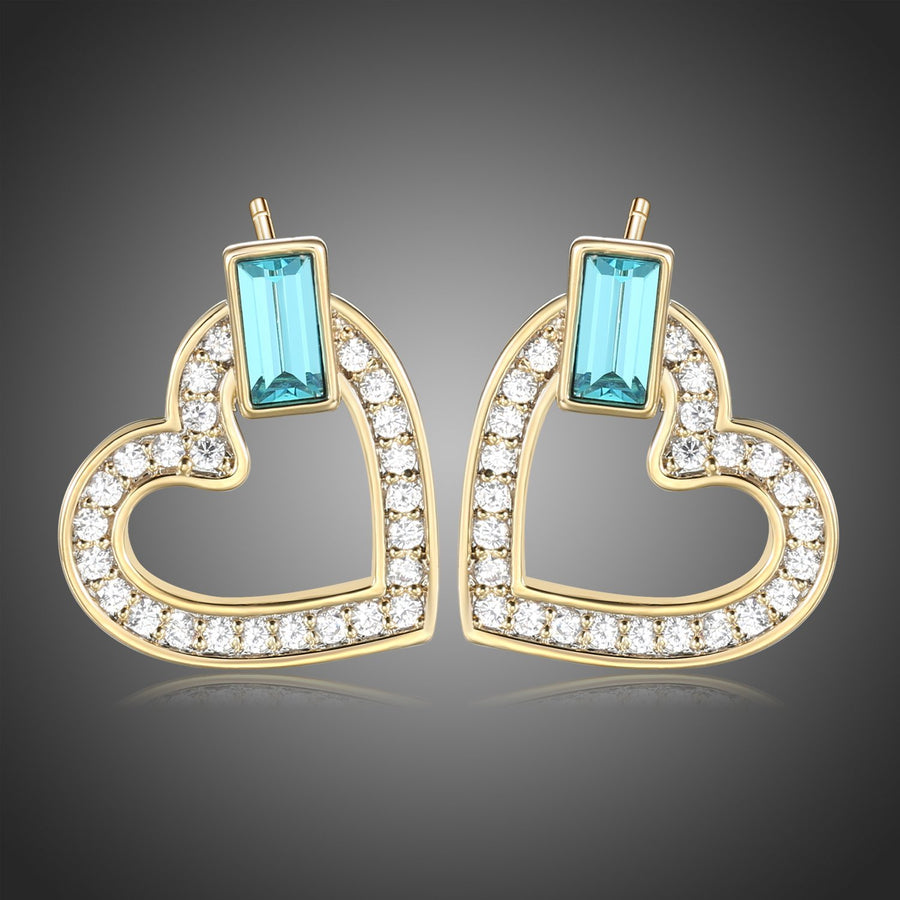KHAISTA blue Austrian crystal heart stud earrings on white background