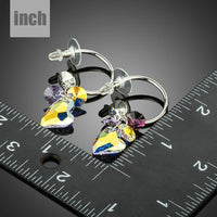 heart charm crystal drop earrings detail view by KHAISTA