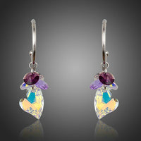 KHAISTA heart charm crystal drop earrings on white background