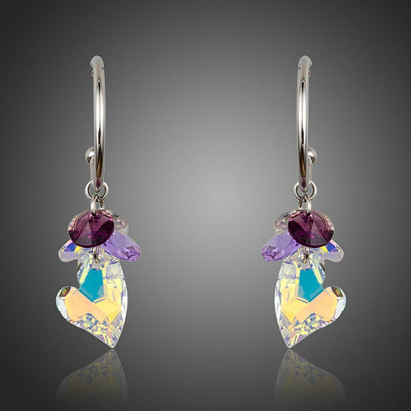 KHAISTA heart charm crystal drop earrings on white background