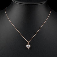 Close up detail of KHAISTA crystal heart pendant necklace