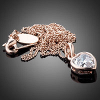 Side angle view of KHAISTA crystal heart pendant necklace