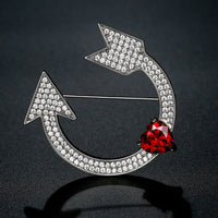 Heart and arrow design detail on Khaista red CZ brooch
