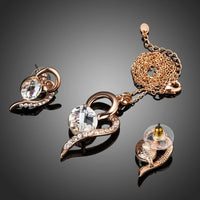 Side angle view of Khaista heart oval gold set