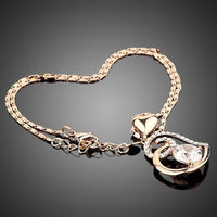 Close up detail of KHAISTA heart shaped snake chain crystal necklace