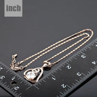 Pendant detail on KHAISTA heart shaped snake chain crystal necklace