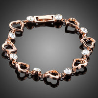 KHAISTA heart toggle clasp crystal bracelet on white background