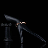 Side angle view of KHAISTA heart toggle clasp crystal bracelet