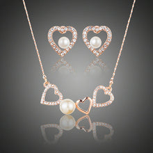 Load image into Gallery viewer, Hearts with a Pearl Stud Earrings + Pendant Necklace Set - KHAISTA Fashion Jewellery

