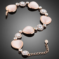 Close up detail of KHAISTA crystal heart stud bracelet