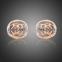 KHAISTA hollow flower crystal stud earrings on white background