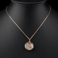 Close up detail of KHAISTA hollow round crystal pendant necklace