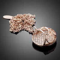 Side angle view of KHAISTA hollow round crystal pendant necklace