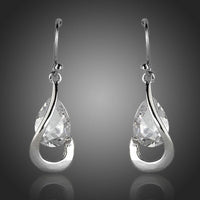 KHAISTA hook design CZ drop earrings on white background