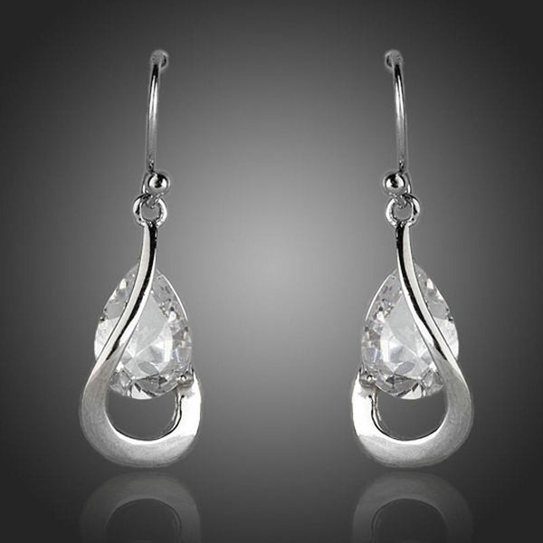 KHAISTA hook design CZ drop earrings on white background