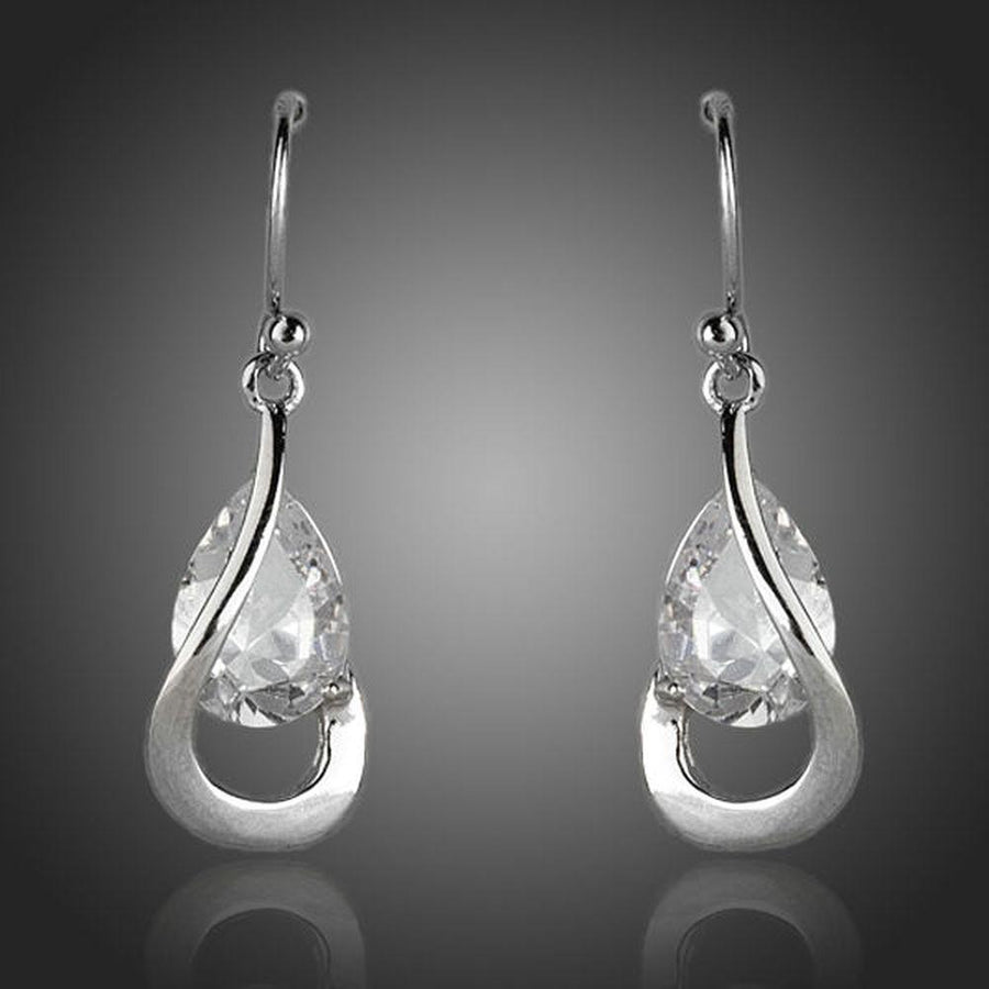 KHAISTA hook design CZ drop earrings on white background