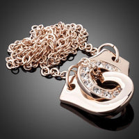 Close up detail of KHAISTA hook link chain crystal necklace