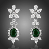 KHAISTA hooker's green CZ crystal drop earrings on white background