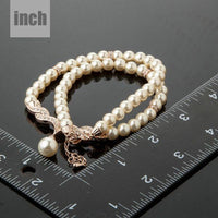 Pendant detail on KHAISTA imitation pearl love crystal necklace