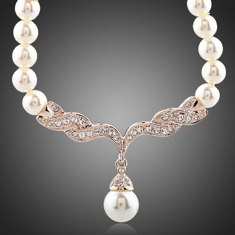 KHAISTA imitation pearl love crystal necklace on white background