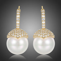 KHAISTA imitation pearl stud earrings on white background