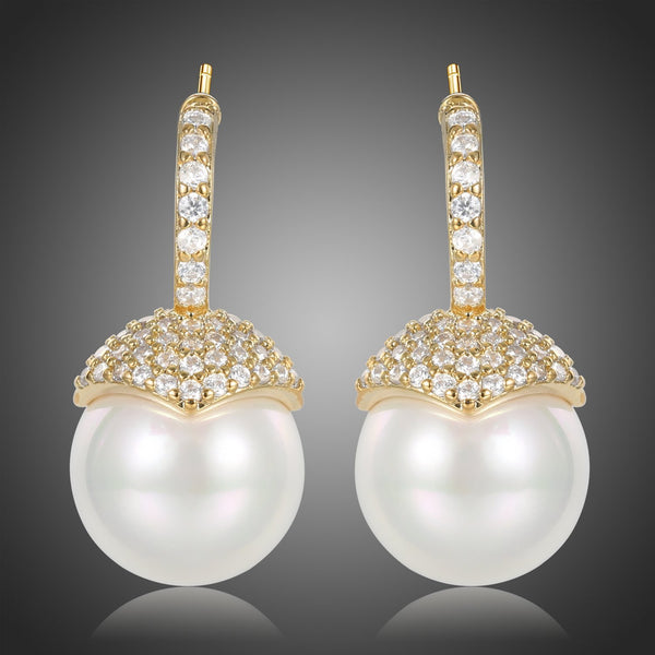 KHAISTA imitation pearl stud earrings on white background