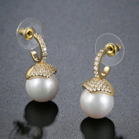 imitation pearl stud earrings detail view by KHAISTA
