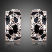 KHAISTA jaguar design crystal clip earrings on white background